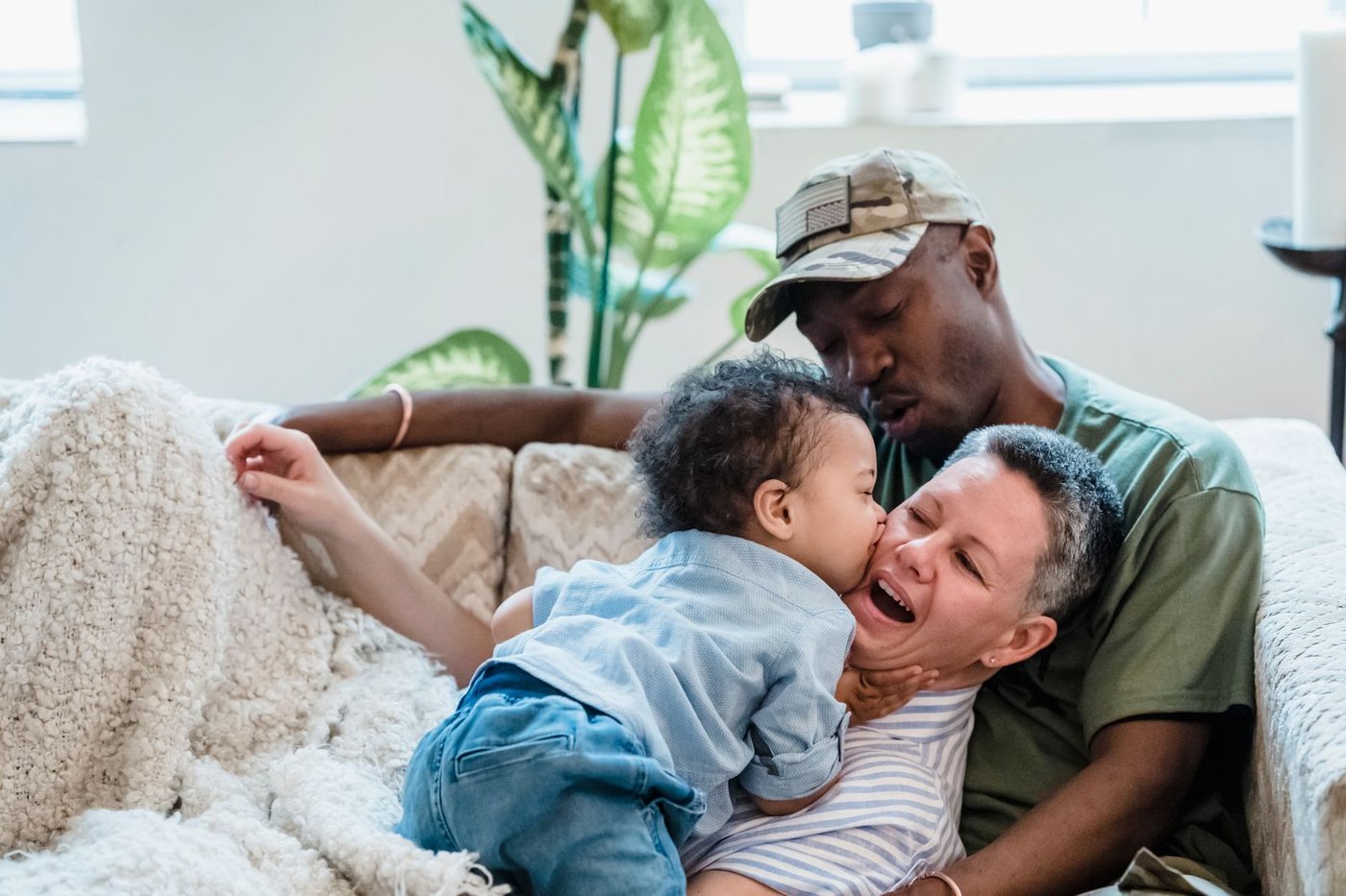 Interracial family sharing a hug at home
